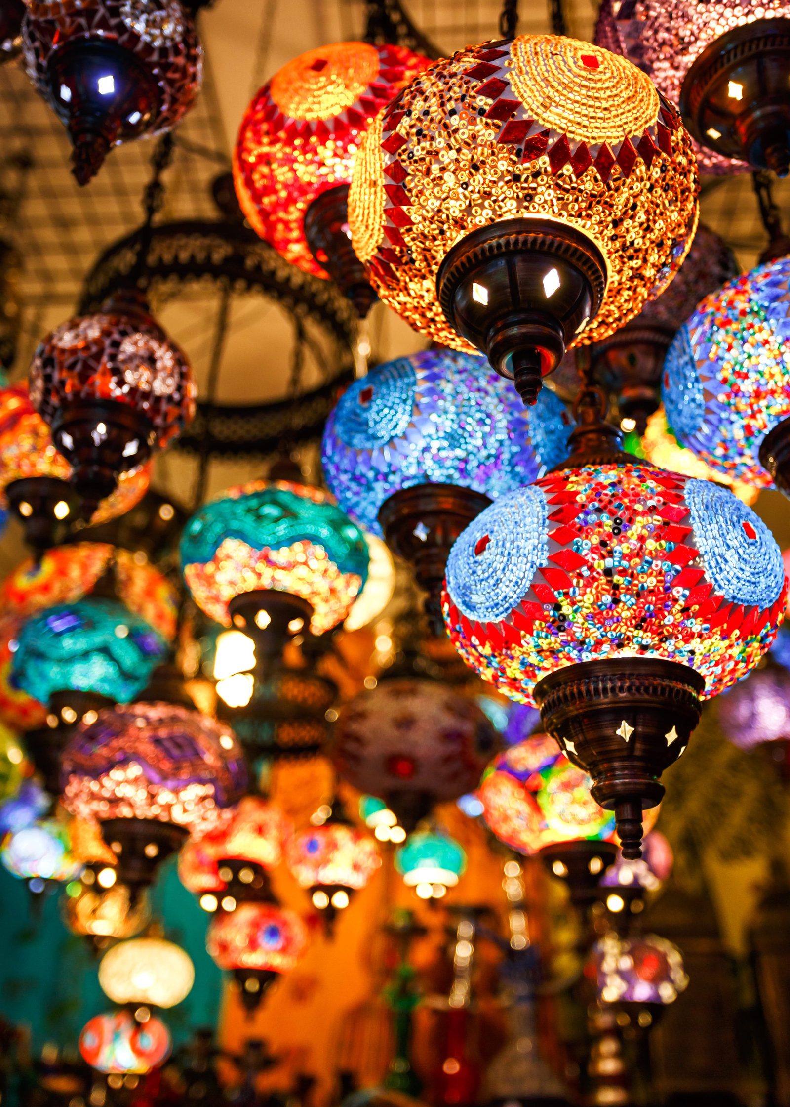 Copper lanterns and colourful lamps hanging in a Marrakech souk