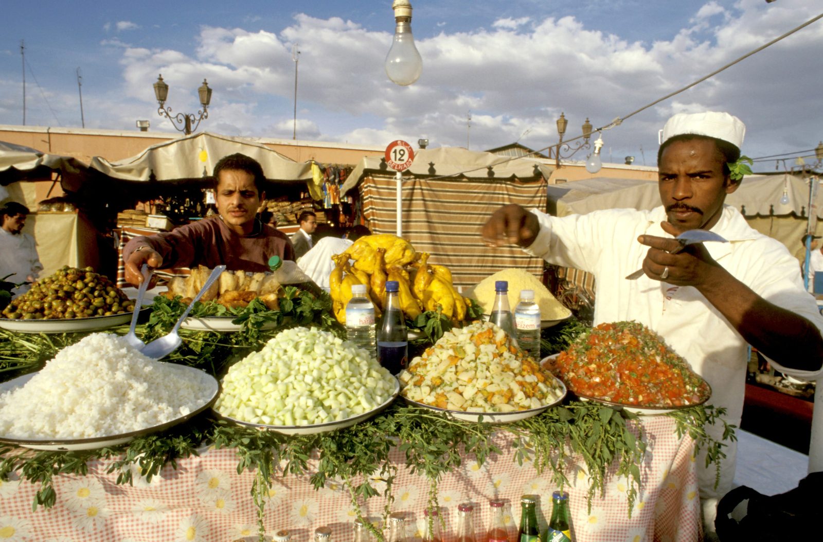 Jemaa el-Fna square alive with food stalls and crowds at dusk